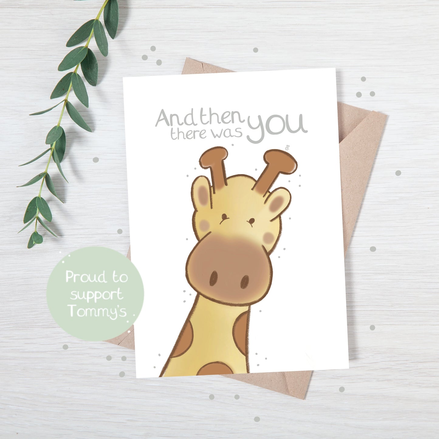 Handmade luxury new baby christening greetings card with a safari theme baby giraffe popping up from the bottom with the title &quote "and then there was you" on a white background, with a kraft envelope