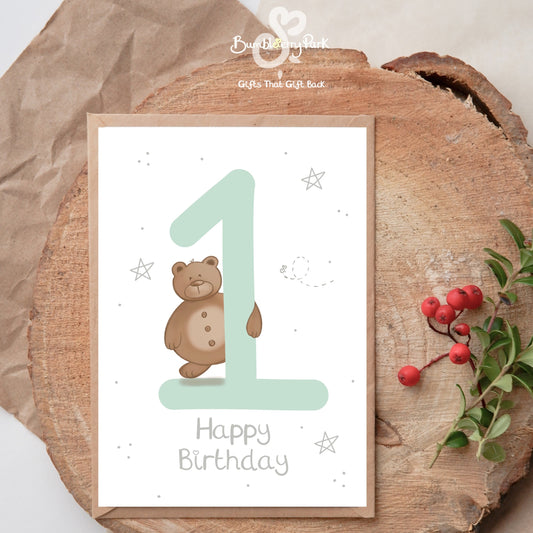 personalised 1st birthday card for baby girl and boy with teddy bear holding a number 1 in pastel colours with silver stars
