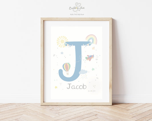 baby name and initial print in bright colours with rainbows sunshine and balloons and aeroplanes