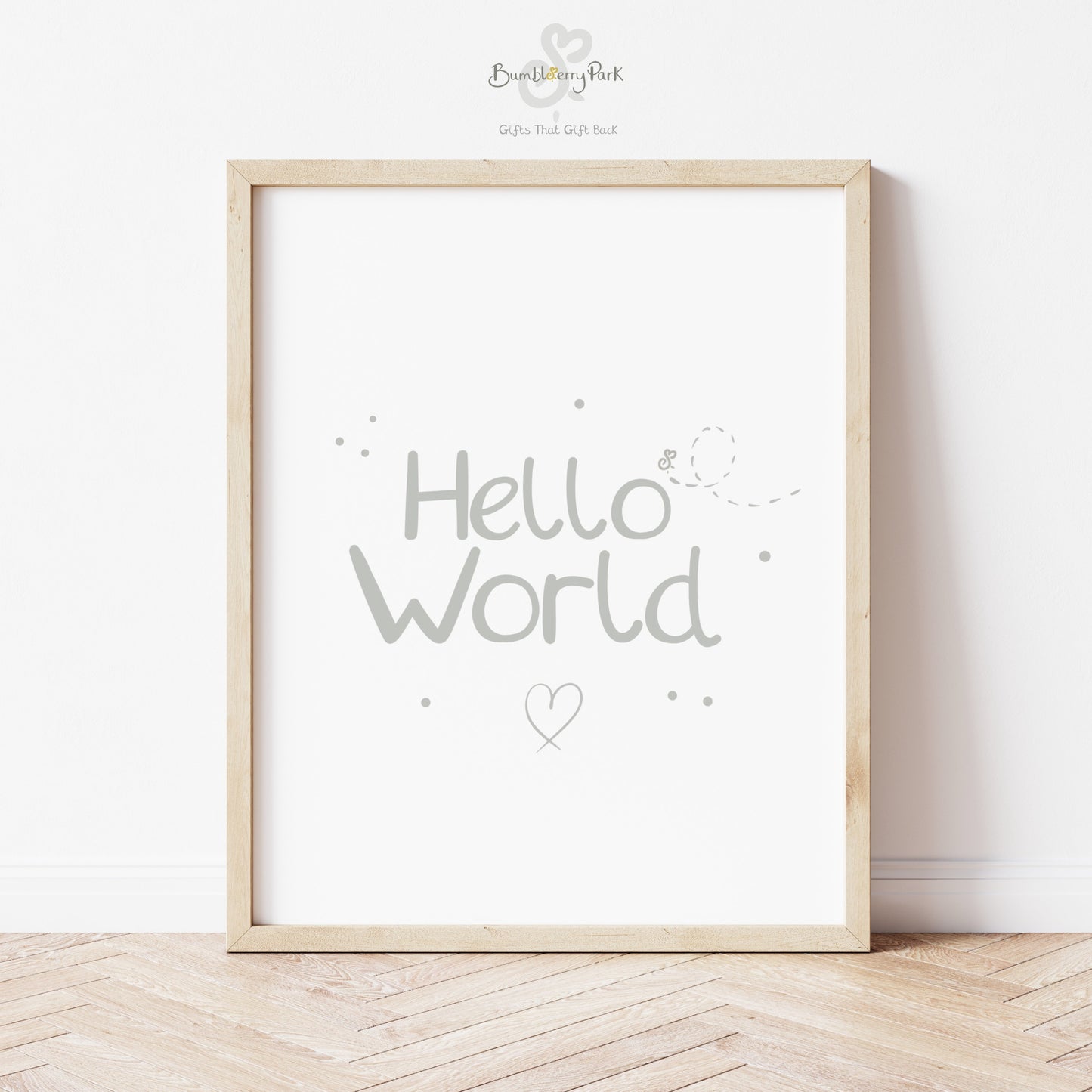 contemporary neutral nursery print with "hello world" text in silver