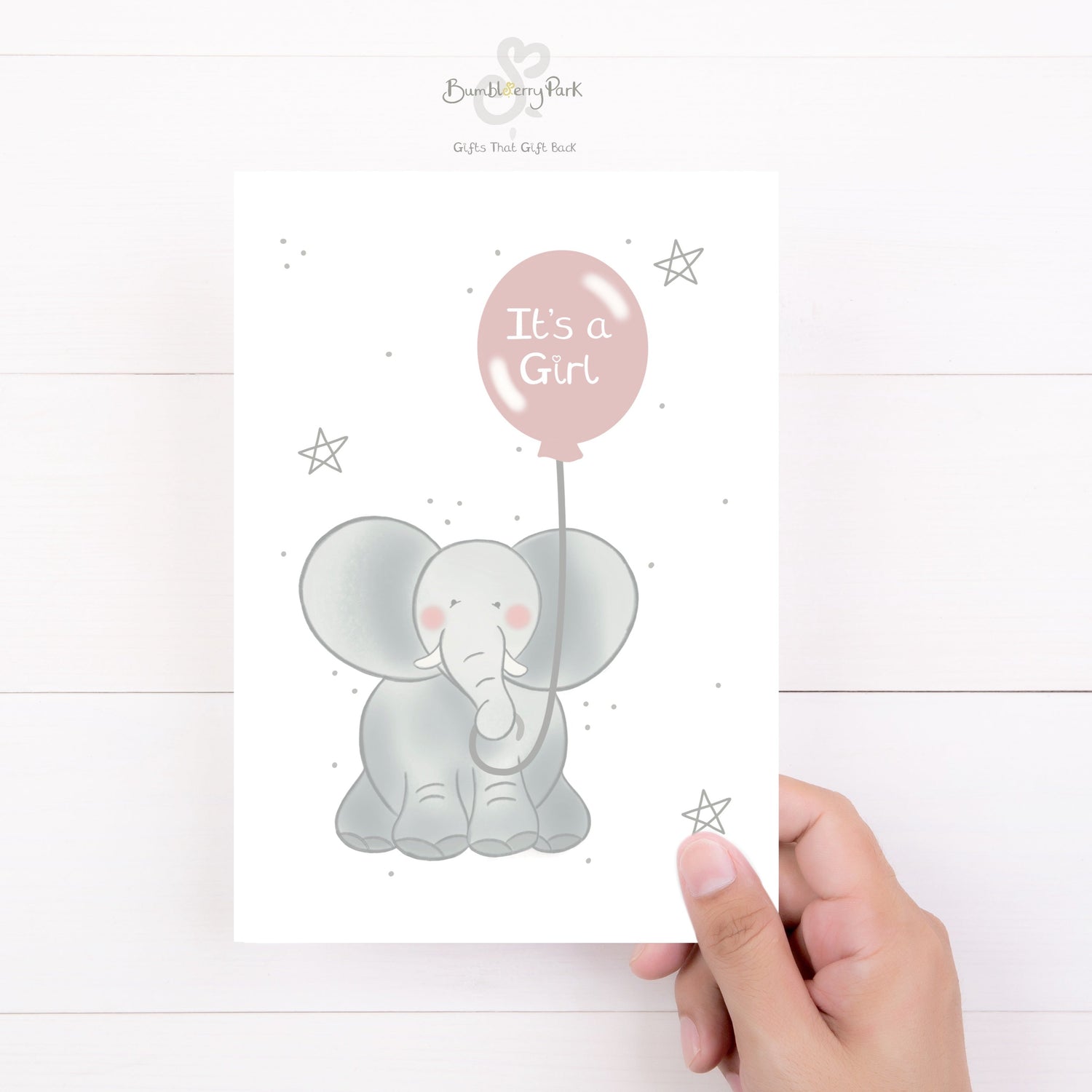it's a girl new baby card for new baby girl as a baby shower gift with a baby elephant holding a pink balloon