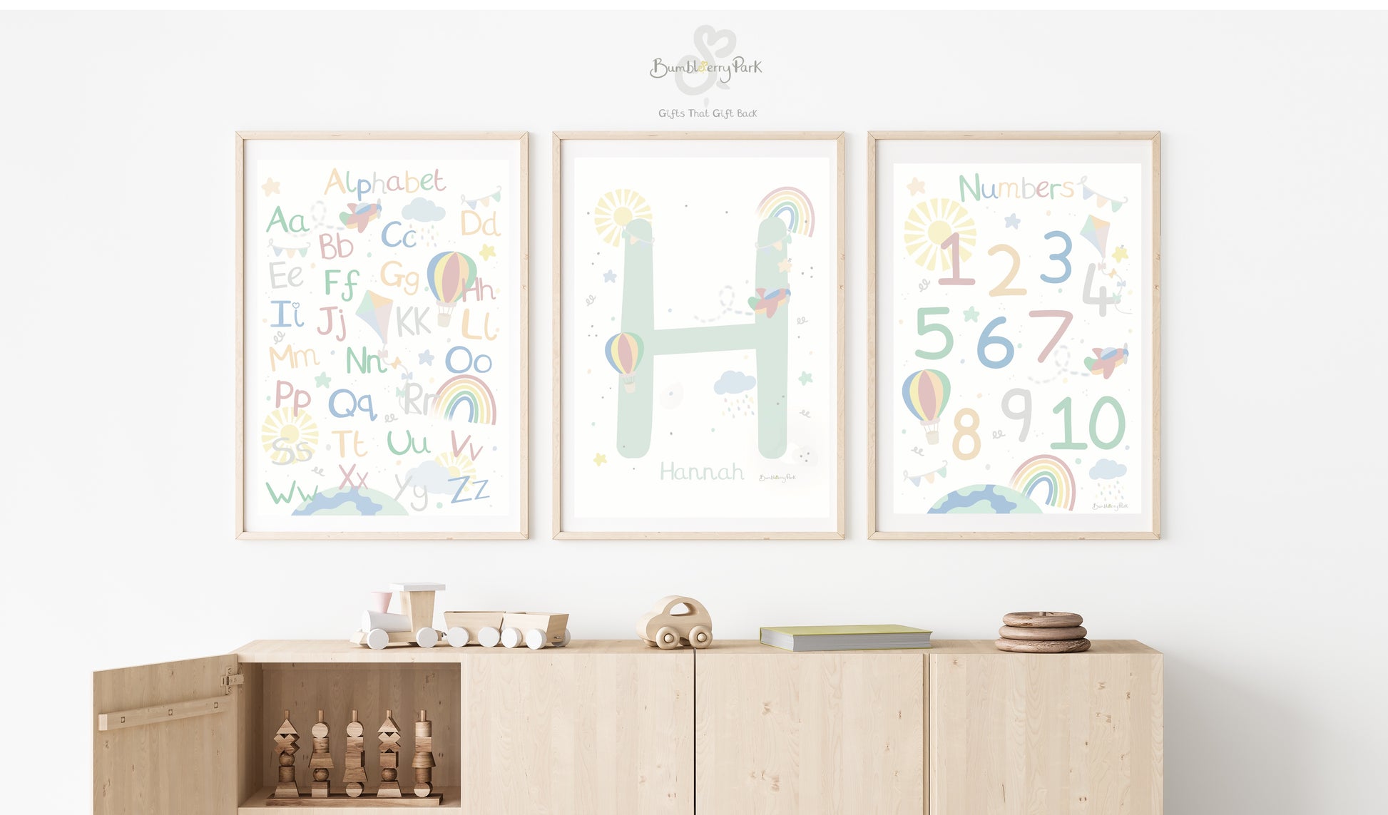 set of three alphabet and number nursery print in pastel colours with little explorer theme with aeroplanes, clouds, hot air balloons kits and rainbows