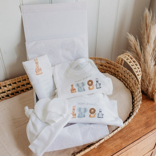 safari animal organic cotton new baby clothing gift set with luxury giftbox placed inside a moses basket