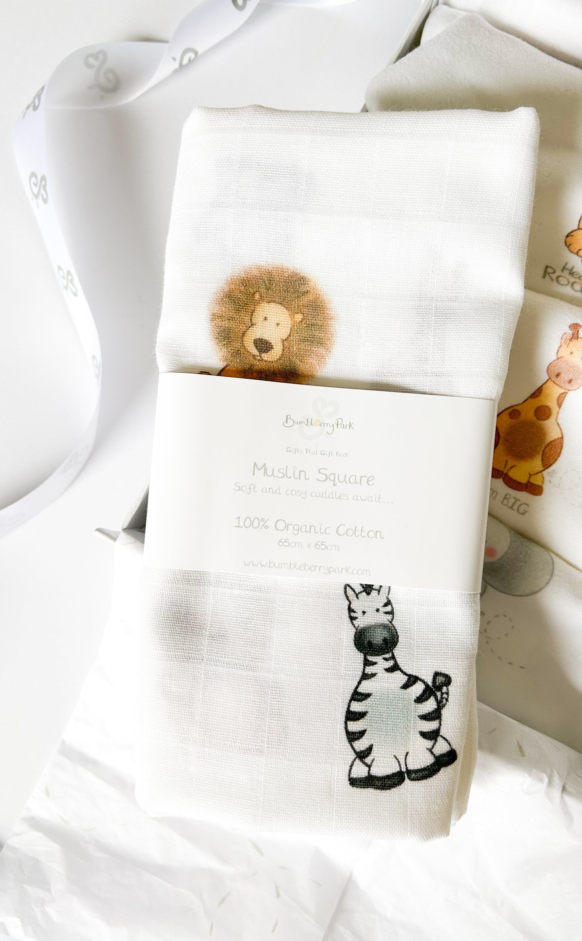 organic cotton white muslin swaddle with safari animal design