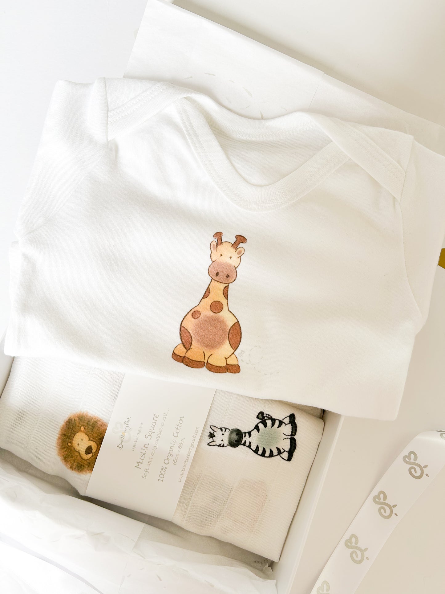 new baby girl organic sleepsuit with cute giraffe print design