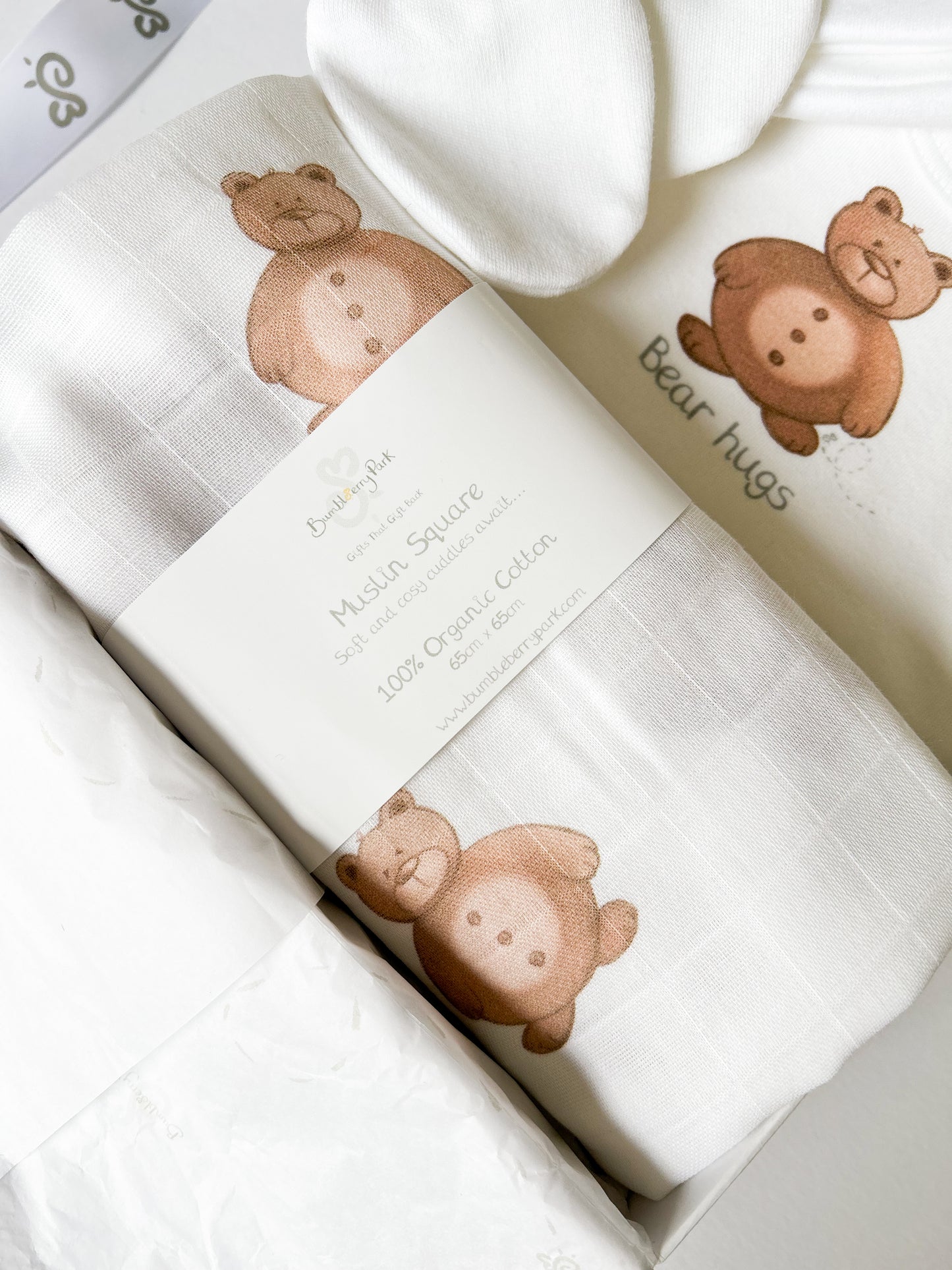 close up of cotton new baby teddy bear print muslin cloth