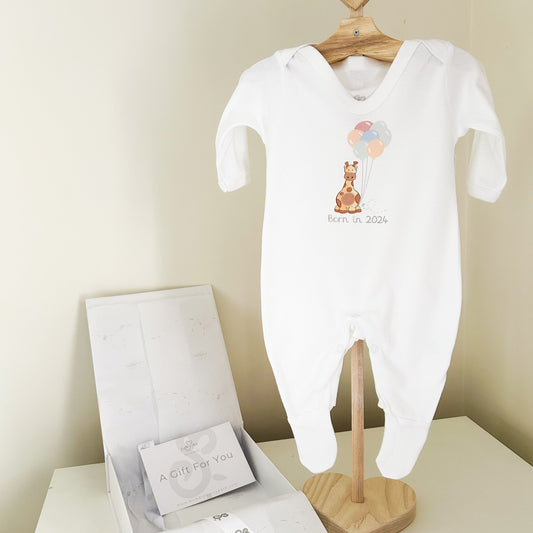 organic white baby sleepsuit babygrow printed with a safari giraffe born in 2024 design with a luxury white gift box