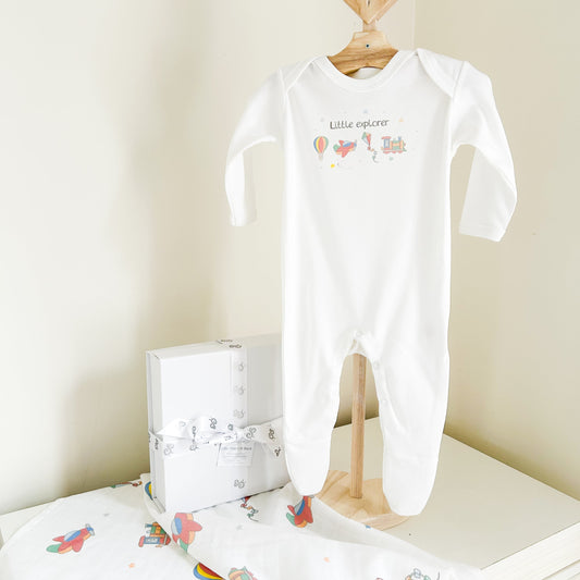 little explorers baby sleepsuit with a hot air balloon, aeroplane, kite and train design