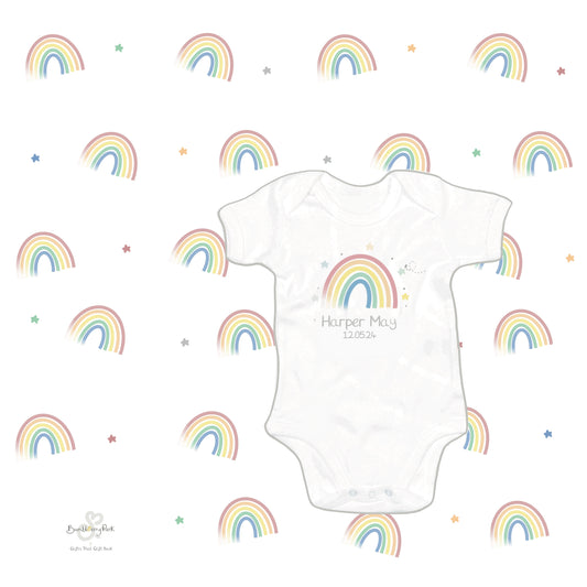 new baby letterbox gift set including muslin square and personalised baby bodusuit with rainbow baby design