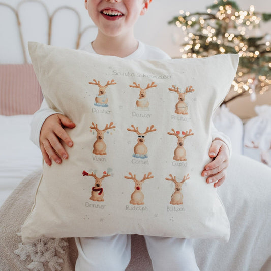 boy holding Santa's reindeer christmas cushion bumbleberry park with zipped storage pocket