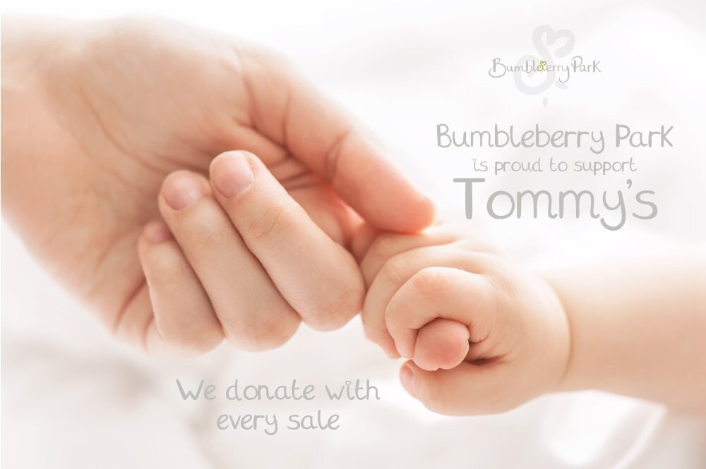 mummy and baby holding hands with information about charity donation from every sale from bumbleberry park