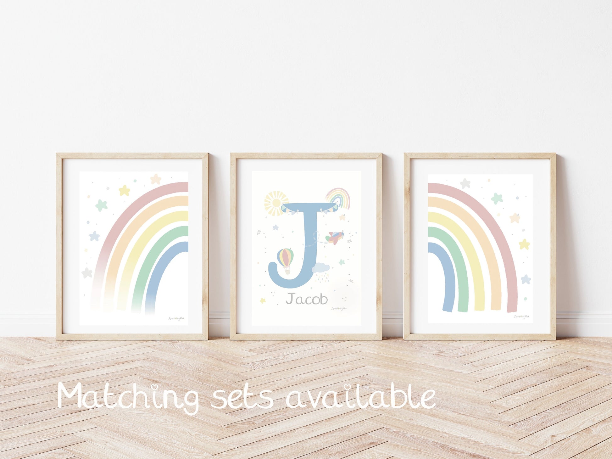 set of three bright colourful nursery prints with rainbow and travel and weather illustrations